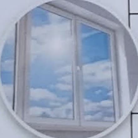 A cleaned window reflecting blue sky and cloud